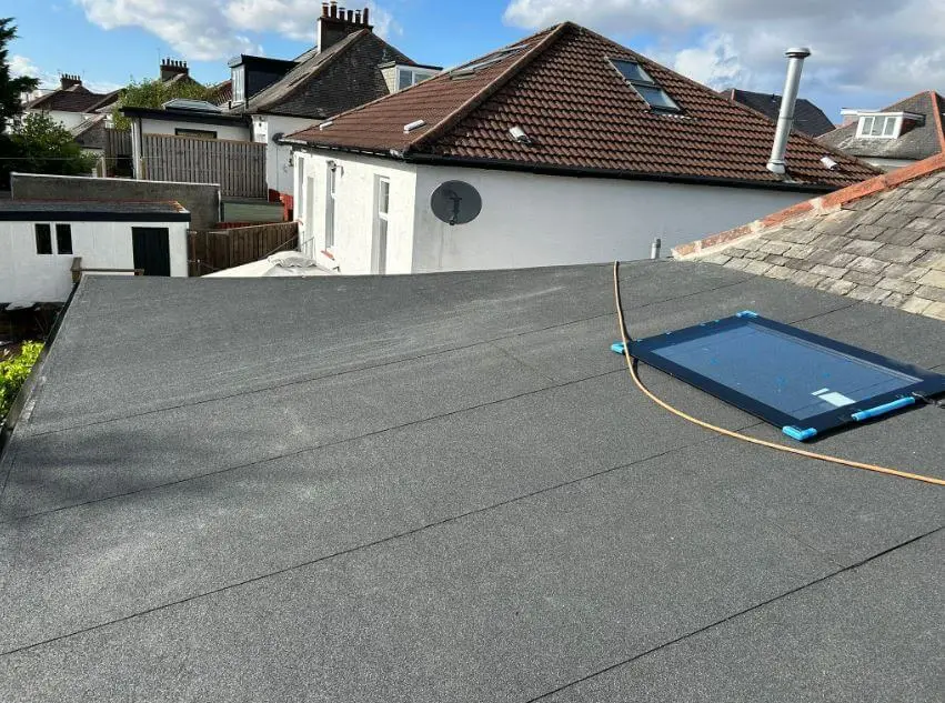 Finished felt flat roof with a roof window