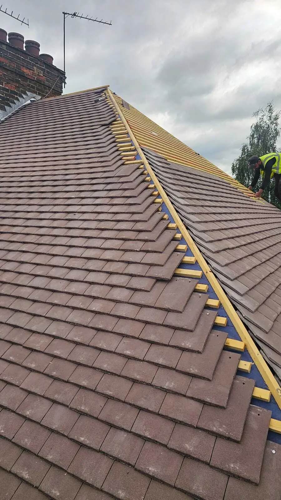 Plain tiles going on over new battens