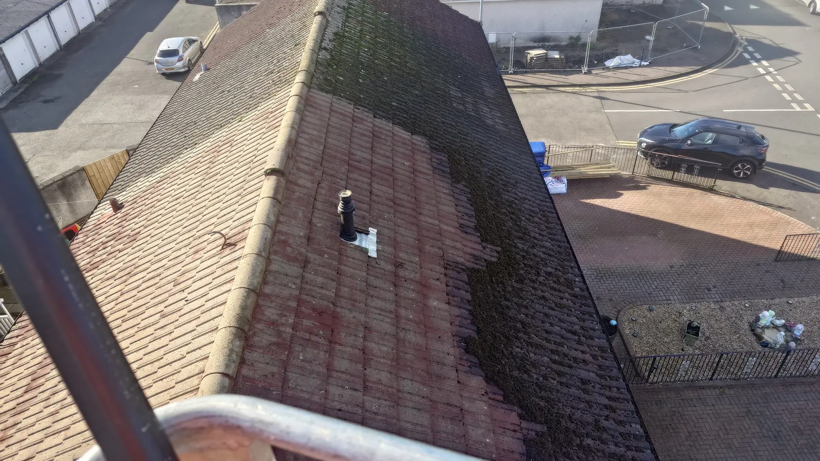 Moss covered tiled roof seen from above