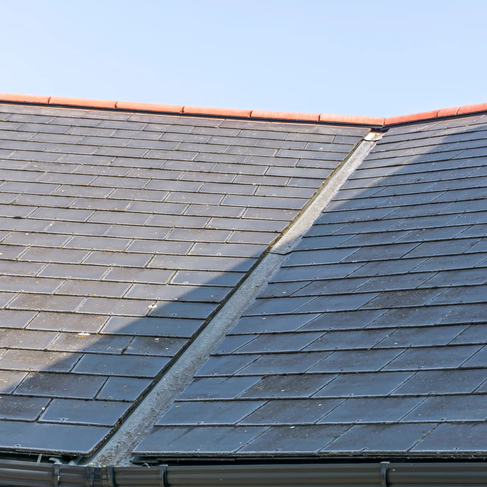 Slate roof with a valley and clay ridge