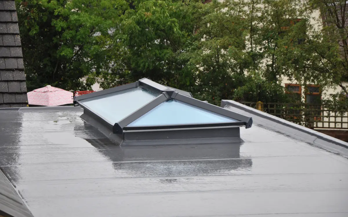 Flat roof with a roof lantern after rain