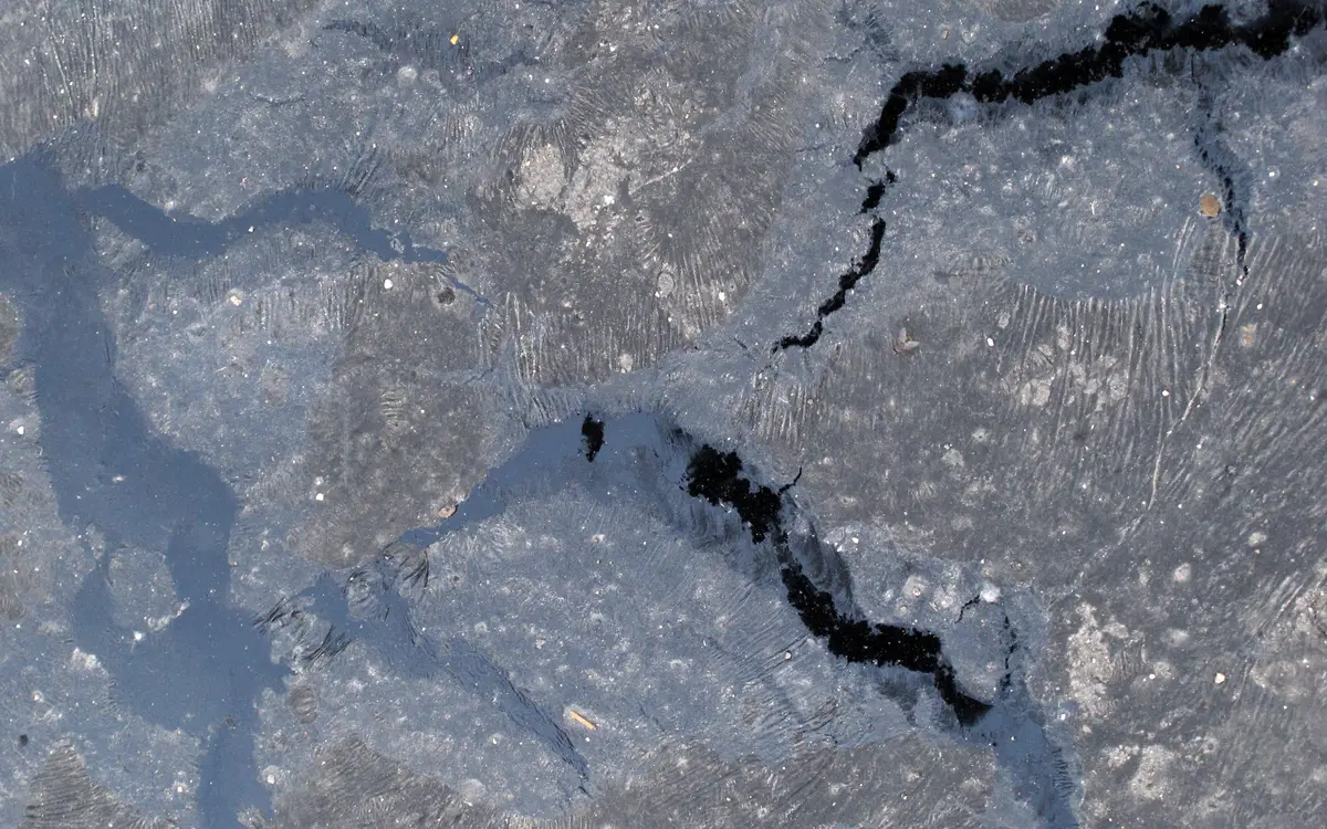 Cracks in a worn roof covering after rain