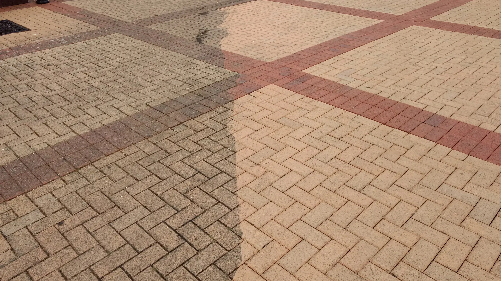 Block paving part cleaned, with clean and dirty sections side by side