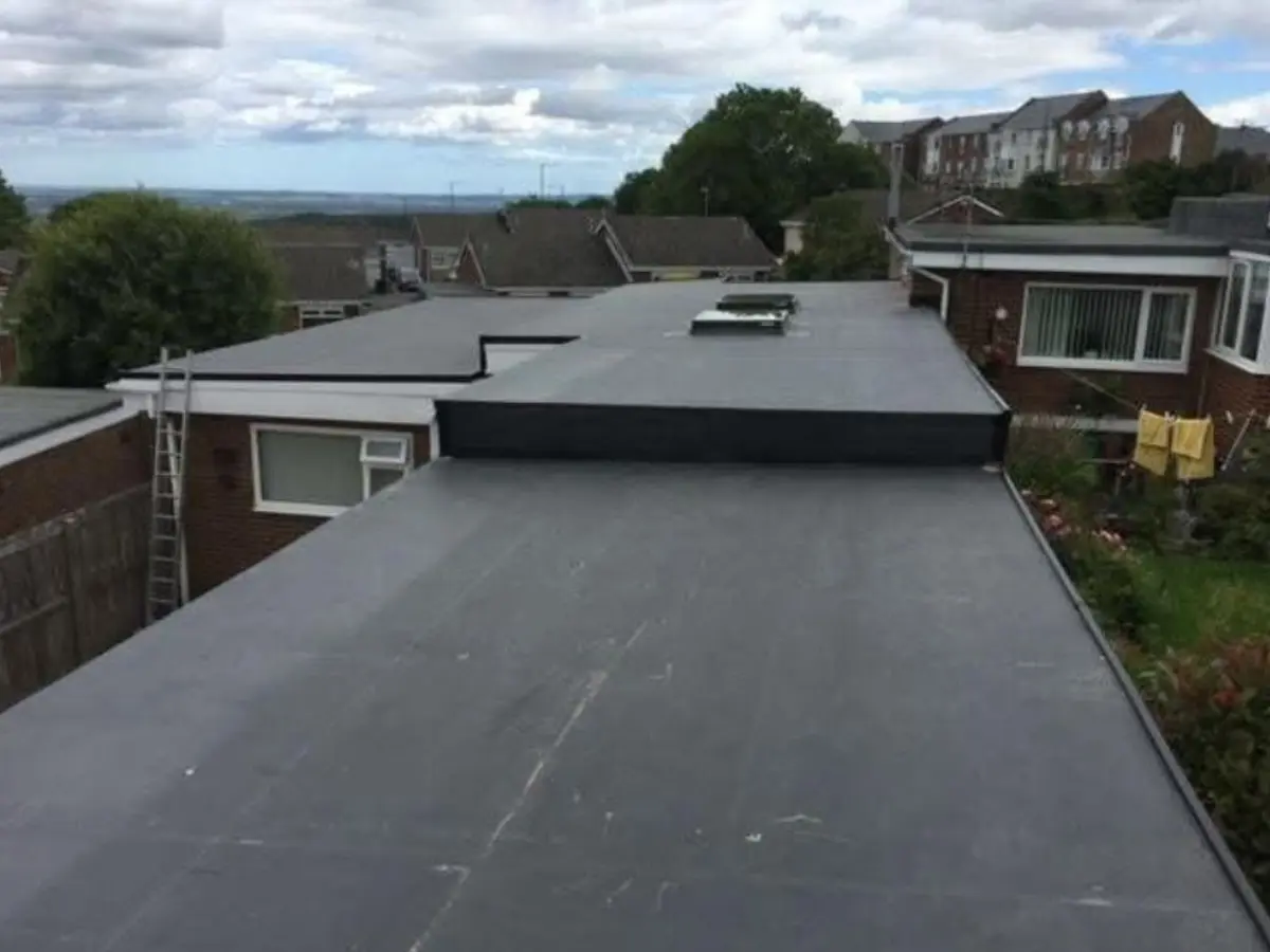 New black rubber flat roof on a rear house extension